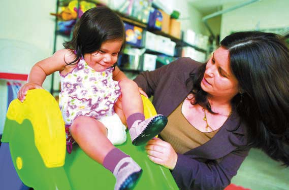 photo: Cheryl Bray with her adopted daughter, Paolina; credit: Fred Greaves for The Washington Post