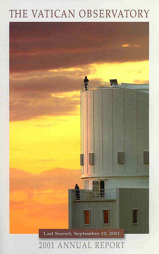 Photo of Aileen O'Donoghue on top of the dome of the Bok 90" telescope at Kitt Peak National Observatory in Arizona. Chris Corbally, SJ, is on the deck below.