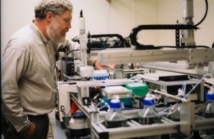 Harvard geneticist George Church and his MAGE prototype. Image courtesy of Marie Wu.