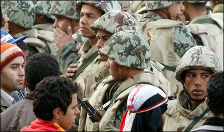 Photo credit: REUTERS/Goran Tomasevic Opposition supporters faced Egyptian soldiers at Tahrir Square in Cairo on Sunday. 