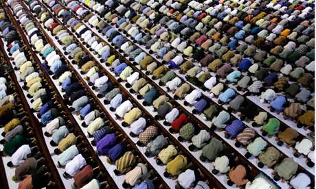 Photograph: Jewel Samad/AFP/Getty Images; Description: Standard behaviours in early evolution can be seen as the precursor to ritualised religion.