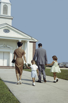 Getty Images: Family of four outside church, 1950s