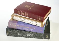 USA Today graphic: Religious books including the King James Bible, The Book of Mormon, The Essence of Bhagavad Gita and The Message of The Quran.
