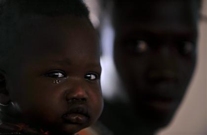 Photo credit: Roberto Schmidt, AFP/Getty Images; Description: child and mother in Africa