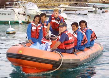 (Photo: AP) Surviving crew members of the Insiko were transported to shore on Tuesday.  Eleven men and one dog had been stranded aboard the tanker since Mar. 13 without power or communications.  "Forgea", the dog, was eventually rescued.
