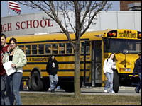 Photo credit: DStan Honda/AFP/Getty Images; Description: Students are seen leaving Dover Area High School. In January, students in biology class will begin a section on evolution.