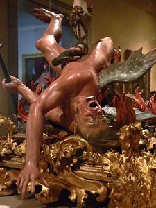 photo of a sculpture depicting satan in hell