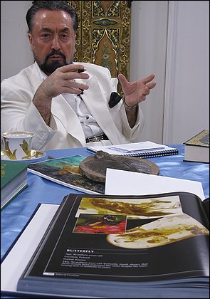 (Photo of) Adnan Oktar, who as Harun Yahya is Turkey's best-known and most assertive critic of evolution, says he is "following the path of Allah."  Credit:  Mark Kaufman