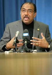 Photo credit: MARTIAL TREZZINI/epa/Corbis; Description: Michel SidibÃ©