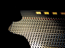 Search photo of shadowy figure at electronic switchboard