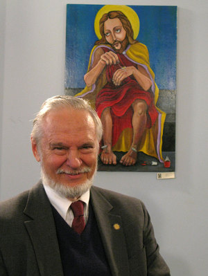 Photo credit: Dianna Douglas/NPR; Description: Stuart Jordan, science adviser to the Center For Inquiry, with the painting Jesus Does His Nails by Dana Ellyn, on display at the Center for Inquiry. Jordan says he would prefer that atheists and secularists not be associated with such artwork.