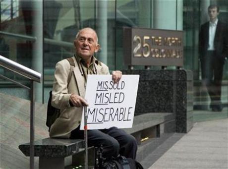 David Randall from Bournemouth sits outside the Financial Services Authority offices in London's Canary Wharf financial district September 15, 2009. Randall, who lost 25,000 pounds ($41,224) in the collapse of Lehman Brothers, was protesting about being sold high risk financial products. Credit: Reuters/Kevin Coombs
