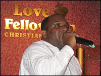 Photo credit: Barbara Bradley Hagerty, NPR; Description: Pastor Sylvester Robinson, seen preaching at his Love Fellowship Christian Church, also leads Jobs Partnership of Florida training sessions.