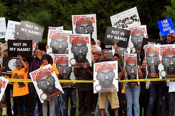 Photo credit: MIKE HASKEY / COLUMBUS LEDGER-ENQUIRER / MCT / LANDOV Supporters of Troy Davis gather across the road from a prison in Jackson, Georgia, Sept. 21, 2011.   