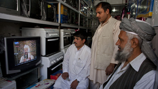 Photo credit: CNN; Description: Afghans watch television coverage announcing the killing of Osama bin Laden at an electronics store in Kabul, Afghanistan.